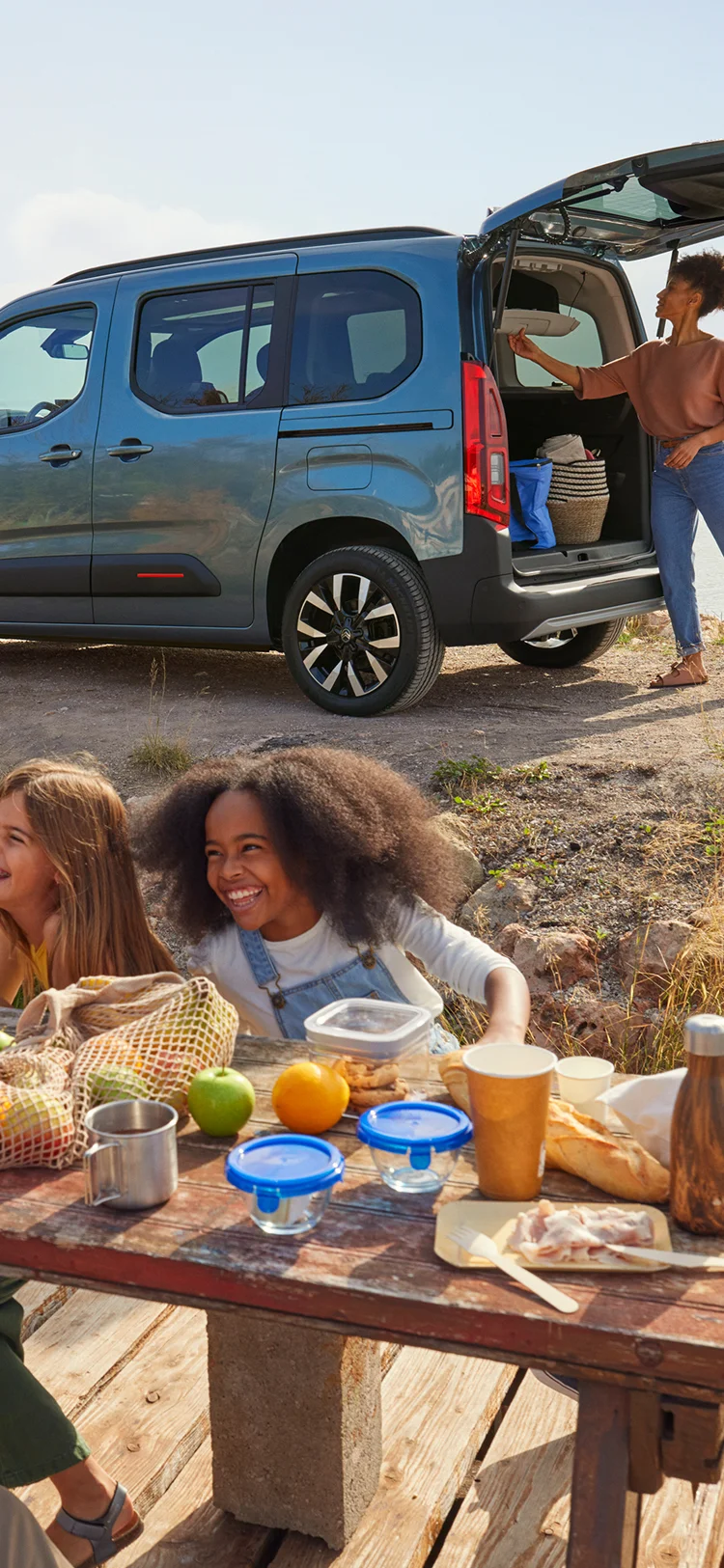 Side view Berlingo with open boot showing spacious loading area, practicality, safety, efficiency and confident family use