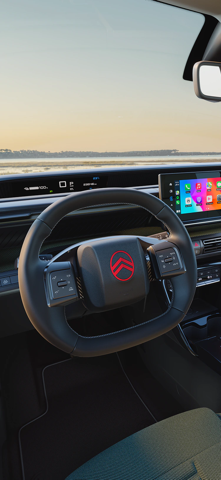 Vista do condutor do painel de instrumentos do Citroën C3 Outdoor com ecrã de infoentretenimento, apresenta a conectividade Advanced Comfort para viagens em família num SUV