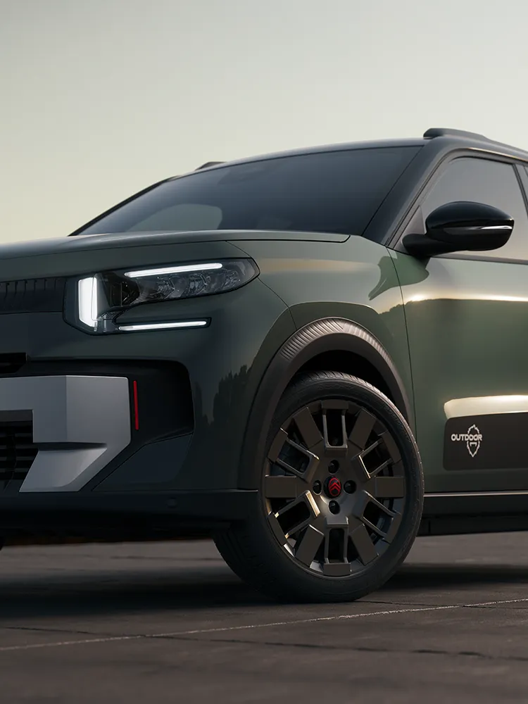 Vista frontal em grande plano da jante de liga leve do Citroën C3 Outdoor e da assinatura LED, apresenta o SUV compacto Advanced Comfort