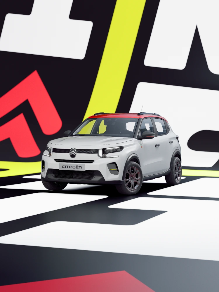 Vista de três quartos da frente do Citroën ë-C3 TONIC, carro elétrico urbano de edição limitada: postura dinâmica e elementos gráficos, uma alternativa inteligente de veículo elétrico